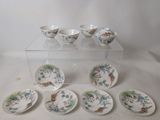 six bowls and six plates on a clear table