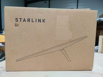 the box is open on a table with a wooden stand in it