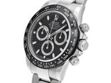 a close up of a watch on a white background with a white background