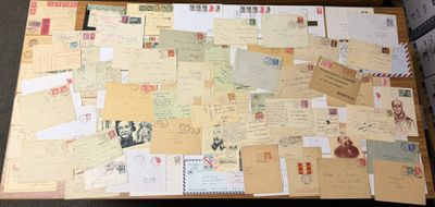 a suitcase full of letters and postcards sitting on the floor