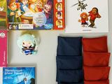 toys and games are laid out on a table for a child ' s play