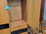 two chairs and a cabinet in a room