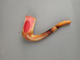 a pipe with a red spot on it on a table