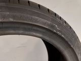 a close up of a tire on a white surface