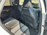 the back seats of a car with a seat belt in the back of it