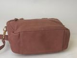 a brown leather bag with a strap on a white background