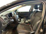 the interior of a car with the door open and the driver ' s seat down