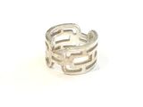 silver ring with inter links on a white background