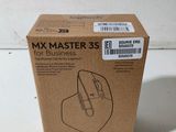 the box of a computer mouse is sitting on the table
