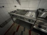 une cuisine équipée d'une cuisinière, d'un four et d'un évier