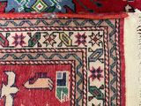 two red and blue rugs with different designs on them