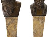 pair of bronze busts of a man and a woman on marble bases