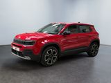 a red volkswagen t - cross suv parked in a white room
