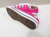 pink converse shoes with white laces are on a white surface
