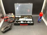 a tool box with tools on a counter next to a bottle of water
