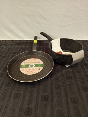 a frying pan and a frying pan on a table
