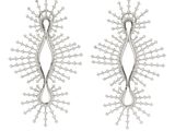 two pairs of silver earrings with white diamonds on them
