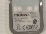 a close up of a cell phone on a white surface