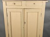 an old wooden cabinet with two doors and two drawers
