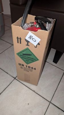 a cardboard box with a bunch of items inside of it
