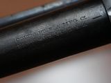 a close up of the barrel of a shotgun with the words ' gunsite battle co ' written on it