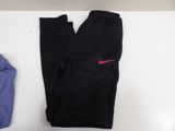 black nike leggings with a pink nike logo on the side