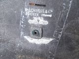 a close up of a piece of metal with a hole in it