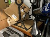 a pile of luggage and a bike in a garage