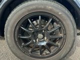 a close up of a car tire on the ground