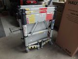a picture of a stack of boxes sitting on a cart in a garage