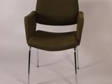 an image of a green chair with chrome legs on a white background