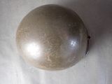 an image of an old helmet on a table