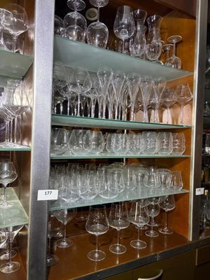 many wine glasses on the shelves in the room