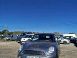 cars parked in a parking lot with a blue sky in the background