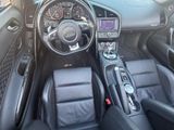 a picture of the interior of a car with a steering wheel and dashboard