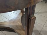 a wooden table with a wooden top on a tile floor