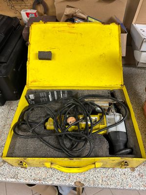 a yellow box with a tool inside of it on a counter