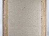 a painting on a wooden easel with a white background