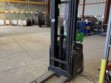 a fork lift truck parked in a warehouse with other equipment