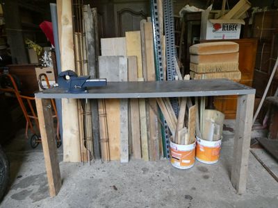 a table that has a lot of wood on top of it