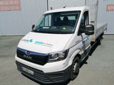 a white van that is parked in front of a building