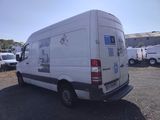 a white van that is parked in a lot