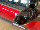 a close up of a car door handle with a sticker on it