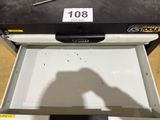 a black and white picture of a drawer with a number on it
