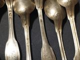 five spoons that are sitting next to each other