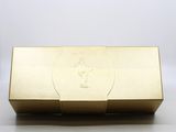 a gold box with a logo on it sitting on top of a table