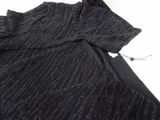 a close up of a black sweater with a black tie on it