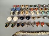 many different types of jewelry on the table