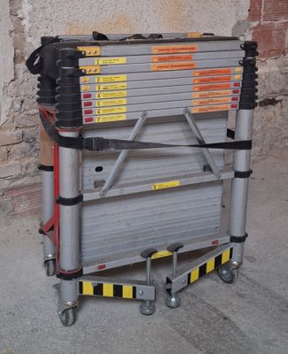 an image of a stack of ladders sitting on the ground