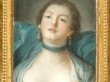 portrait of a lady in a blue dress by a gold frame
